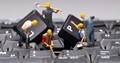 miniature figurines performing maintenance on a keyboard