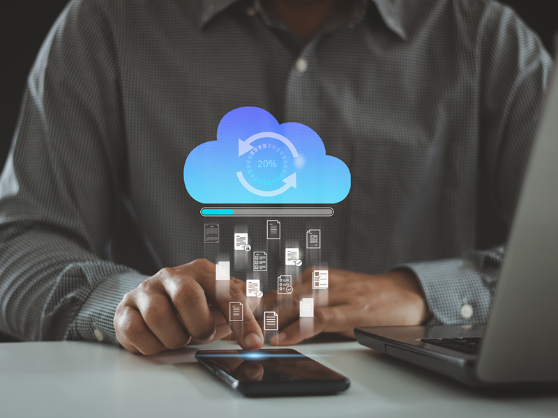 Business professional using a smartphone to upload documents to the cloud, with a digital progress bar and icons representing secure cloud file sharing.